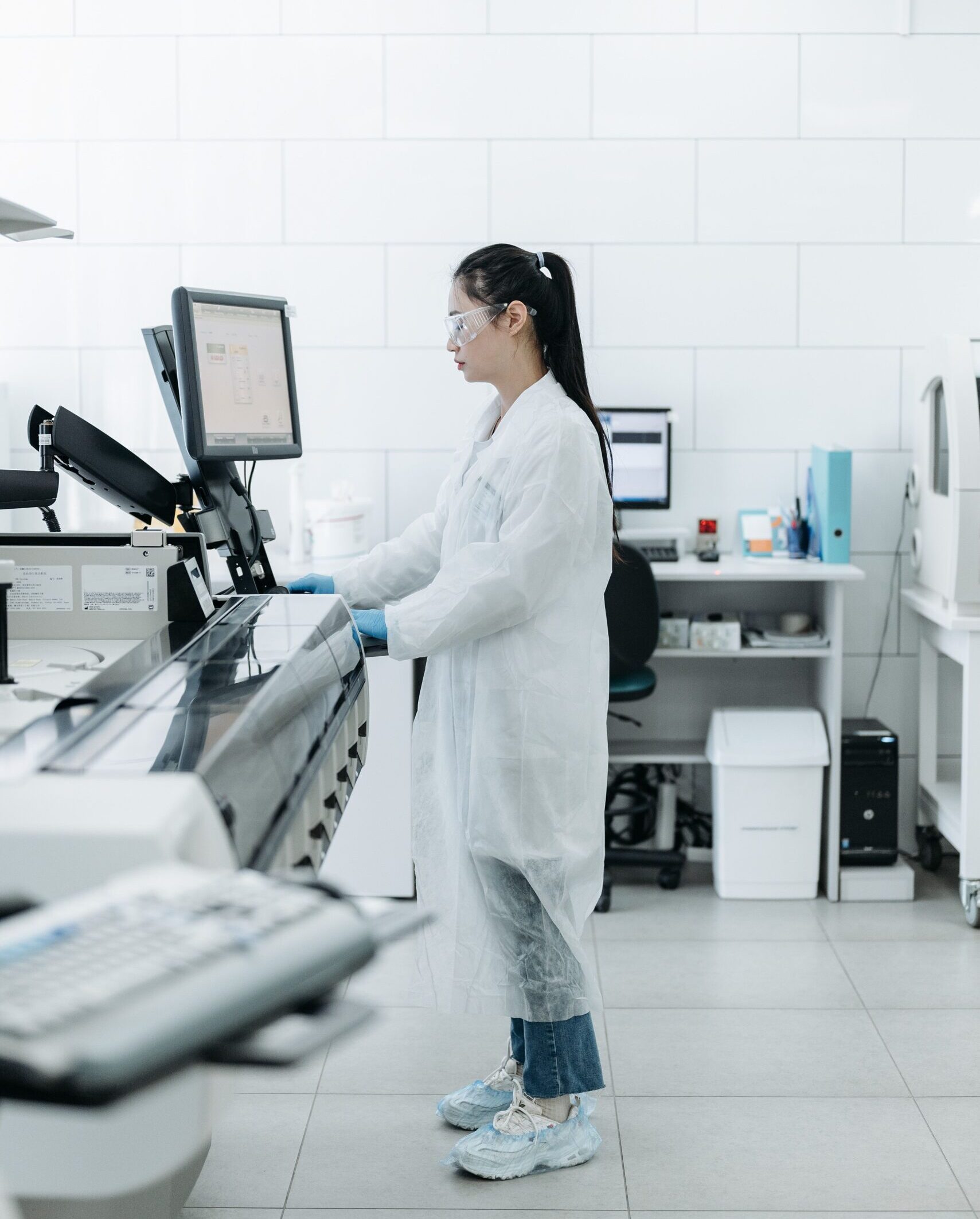 Lab scientist conducting research in a high-tech laboratory environment.